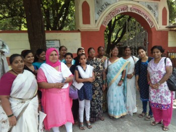 Komal, Rubina and Sapna stand with other members of the Dakshata Committee in Shivajinagar