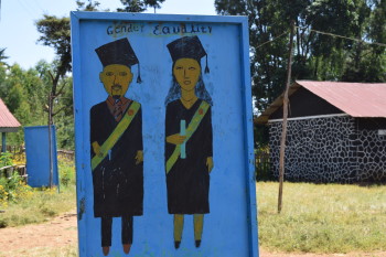 Messaging promoting gender equality greets students upon entry into the schoolyard. Dangila, Ethiopia. November 2014.